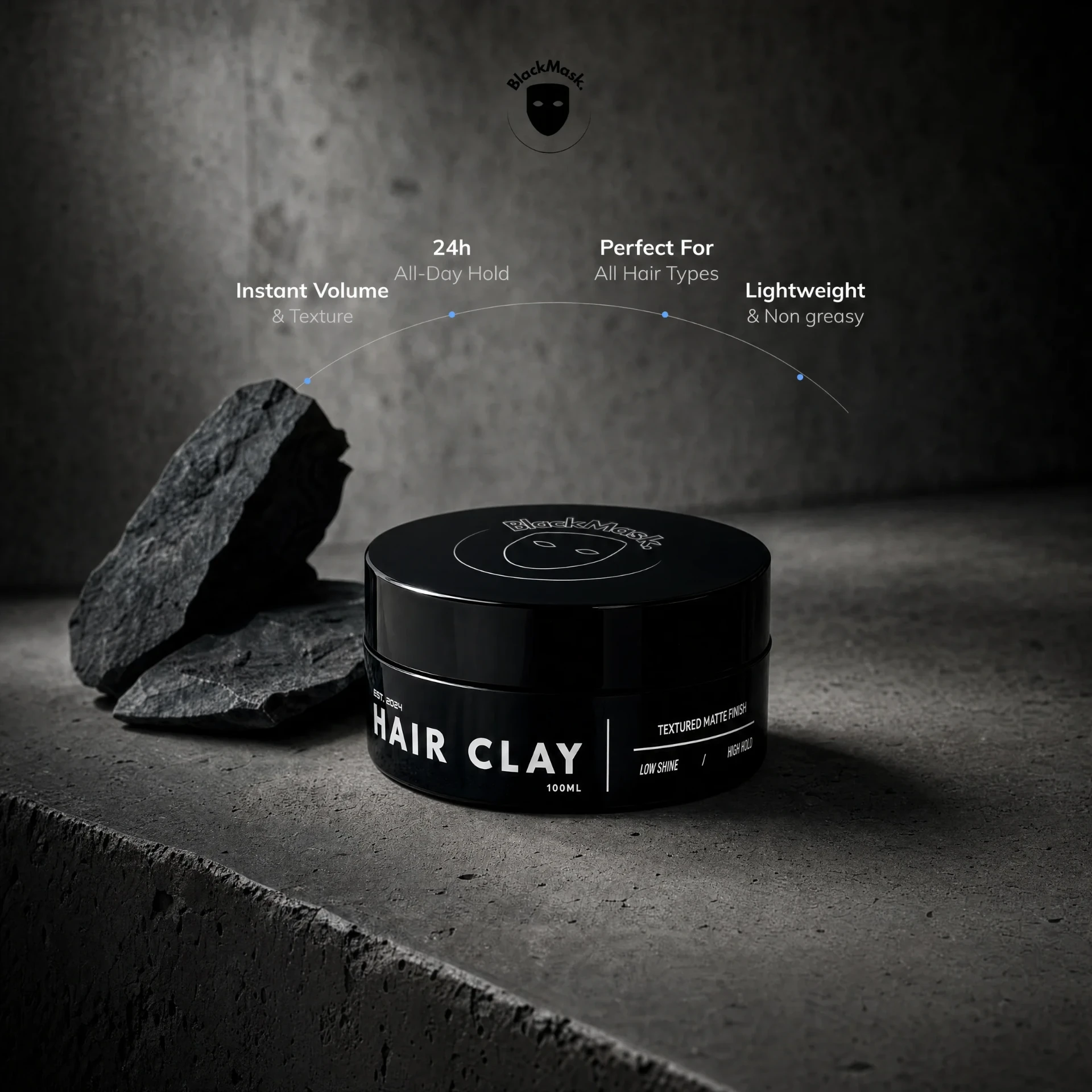 BlackMask Hair Clay 100ml jar, low shine and high hold, beside charcoal rock